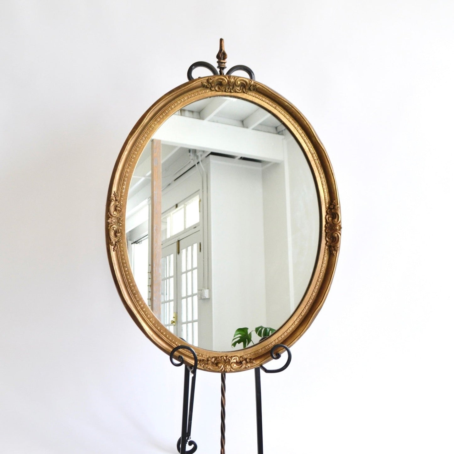 Oval gold antique framed mirror